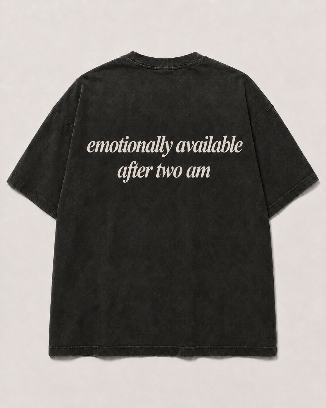 Back of washed black SORRY BABY shirt reading emotionally available after two am in lowercase serif italic