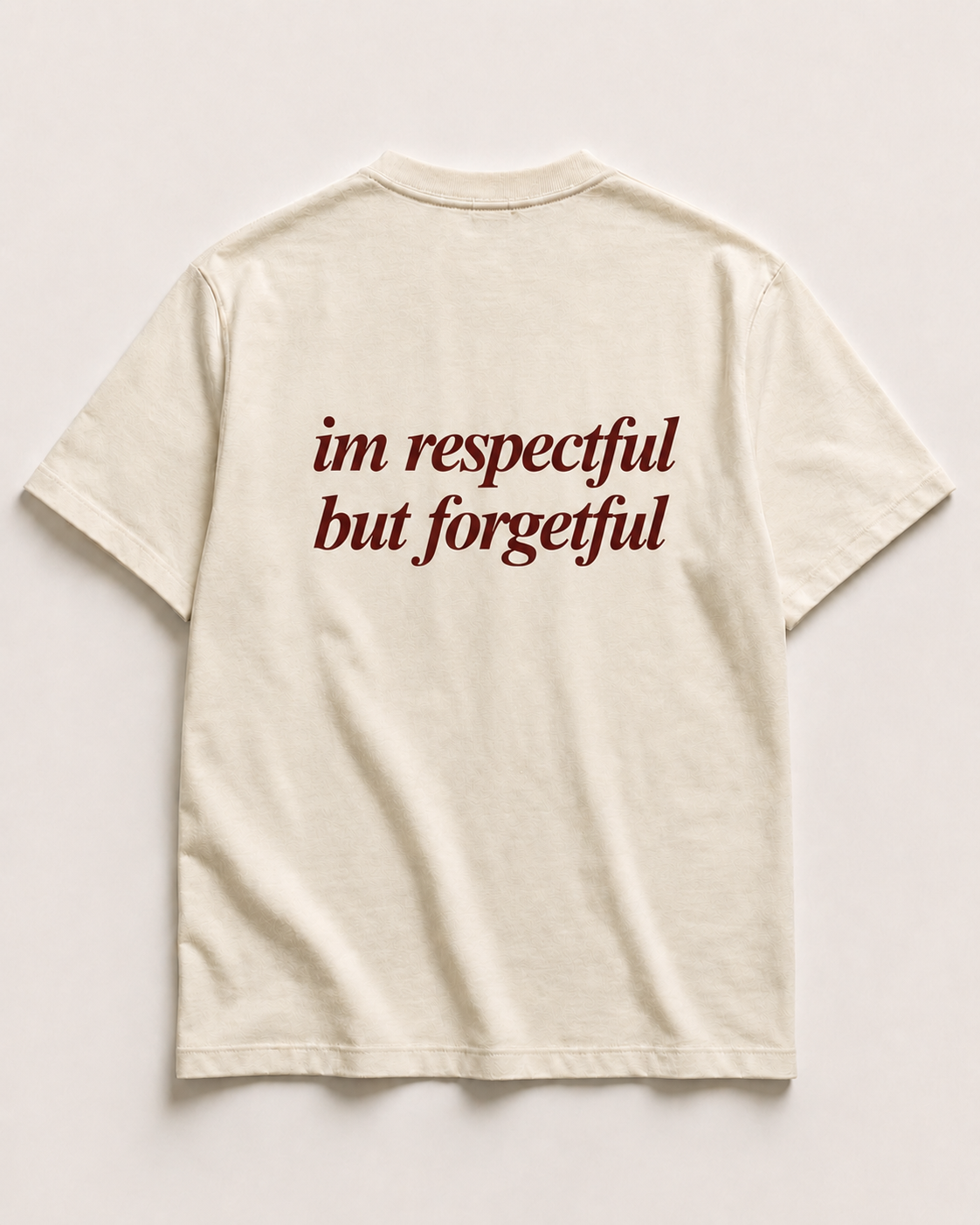 Back of cream SORRY BABY shirt reading im respectful but forgetful in lowercase serif italic