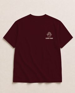 Front logo of the burgundy shirt