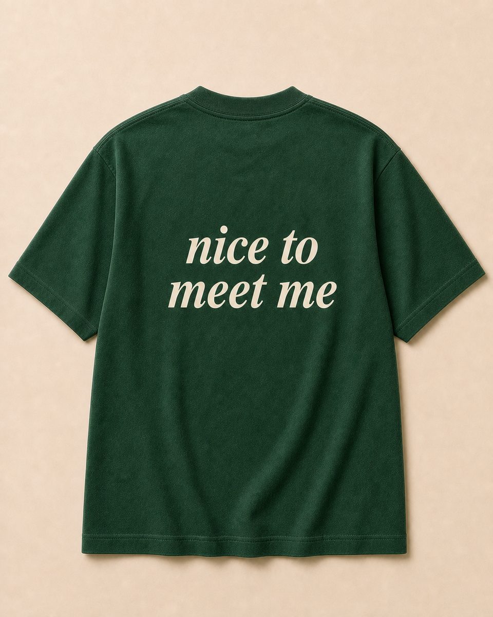 Back of forest green SORRY BABY shirt reading nice to meet me in lowercase serif italic